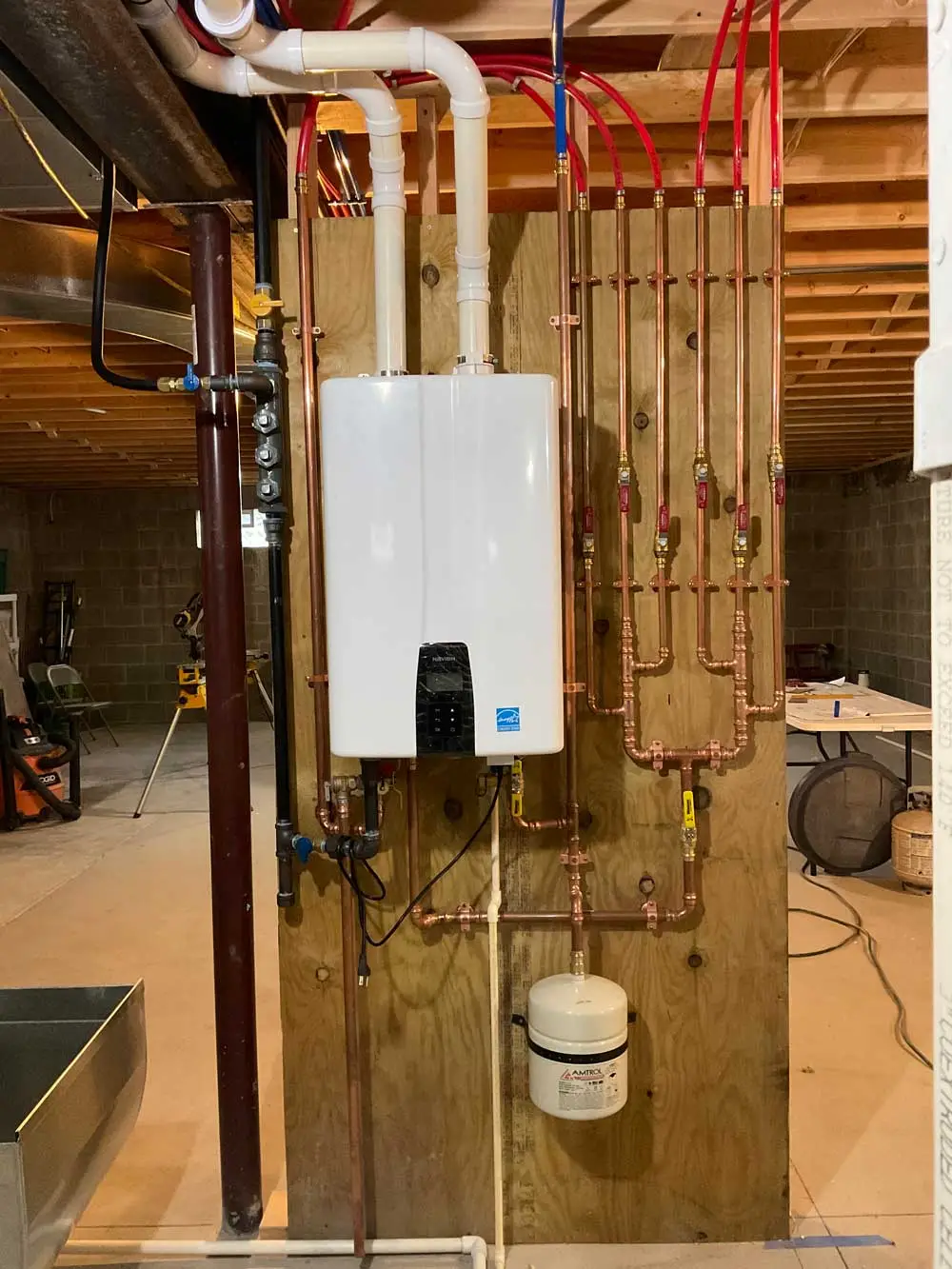 Tankless water heater installed with copper plumbing pipes